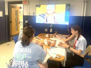UConn nursing EINP Students do baby training