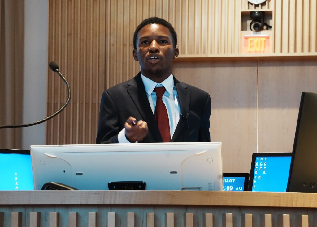 HCOP high school researchers Abraham Olasunkanmi presenting
