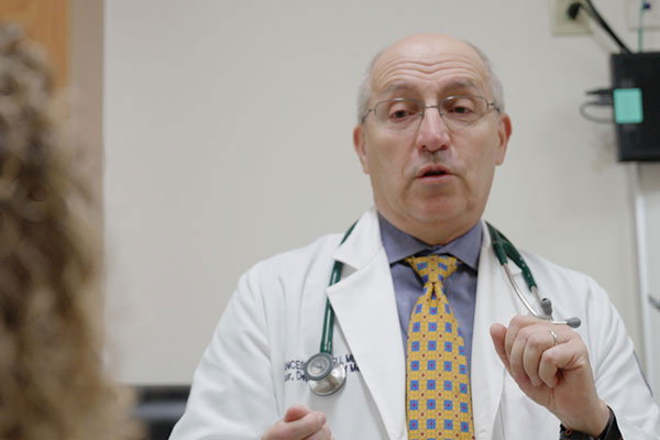 still frame physician speaking to patient