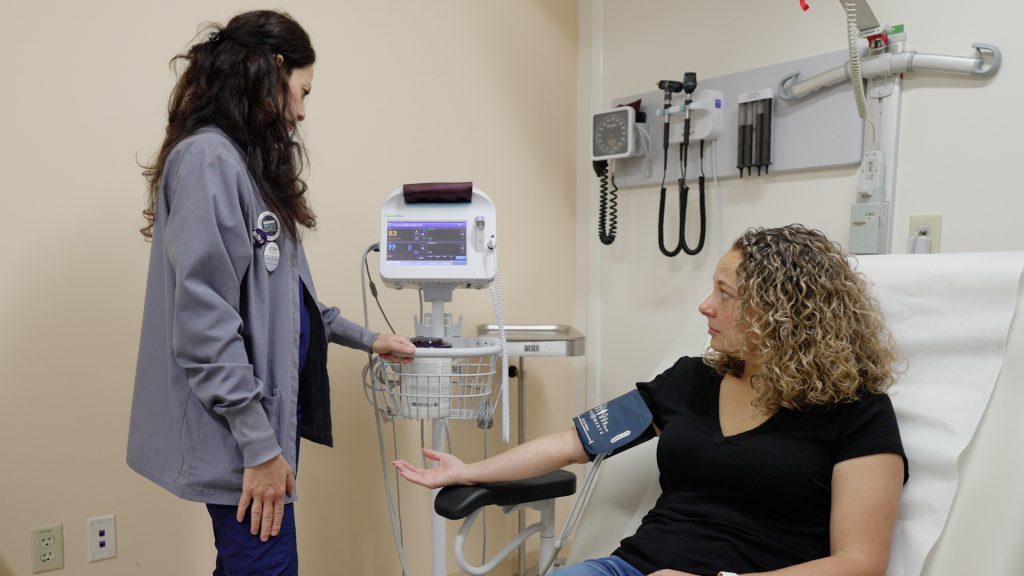 Hypothyroid patient Jenna Bartley having her blood pressure checked during an exam at UConn Health. (Ryan Bernat/UConn Health)
