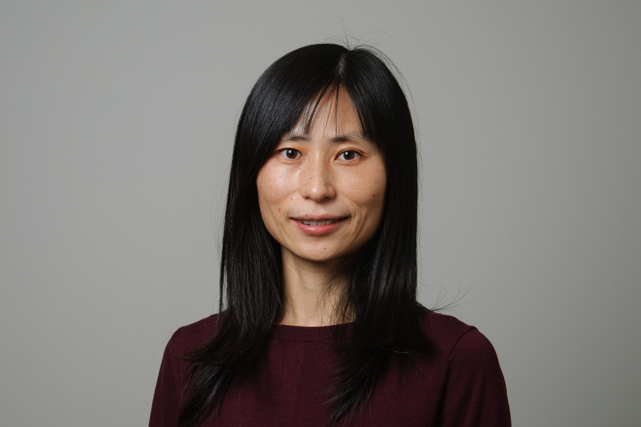 headshot of woman with black hair