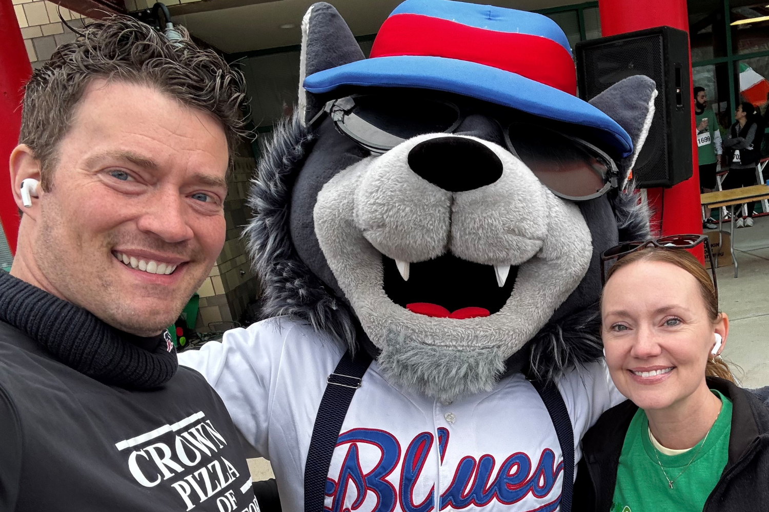 man and woman with wolf mascot