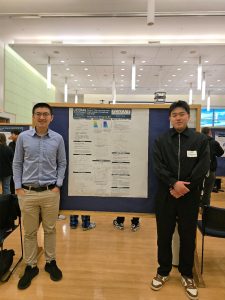 Chang Liu and a student stand beside a research poster at a UConn poster session.