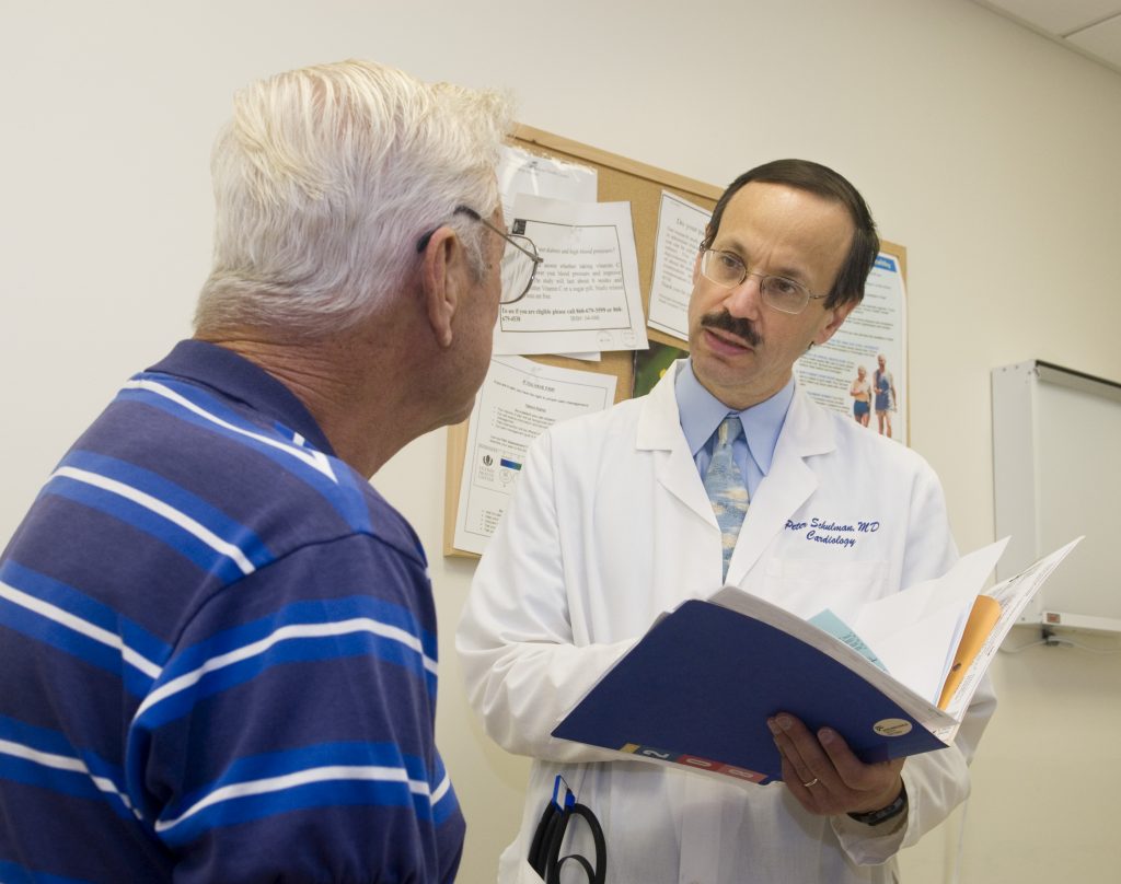 Peter Schulman, MD, meeting with a patient at UConn Health.