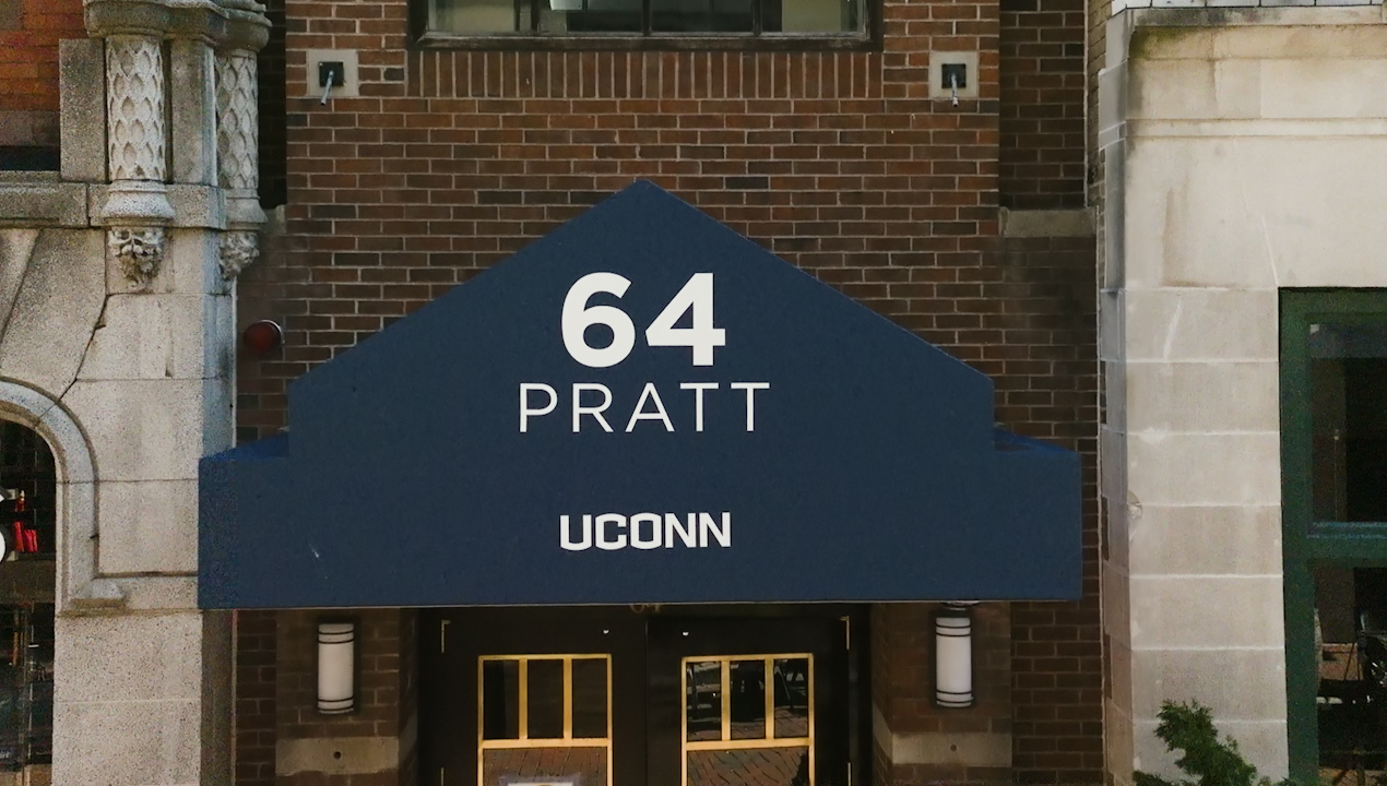 A blue awning that says "64 Pratt, UConn"
