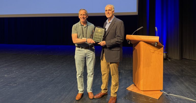 Dr. Steven G. Kinsey receives the 2026 International Cannabinoid Research Society Mid-Career Award during the organization's annual symposium in Dijon, France