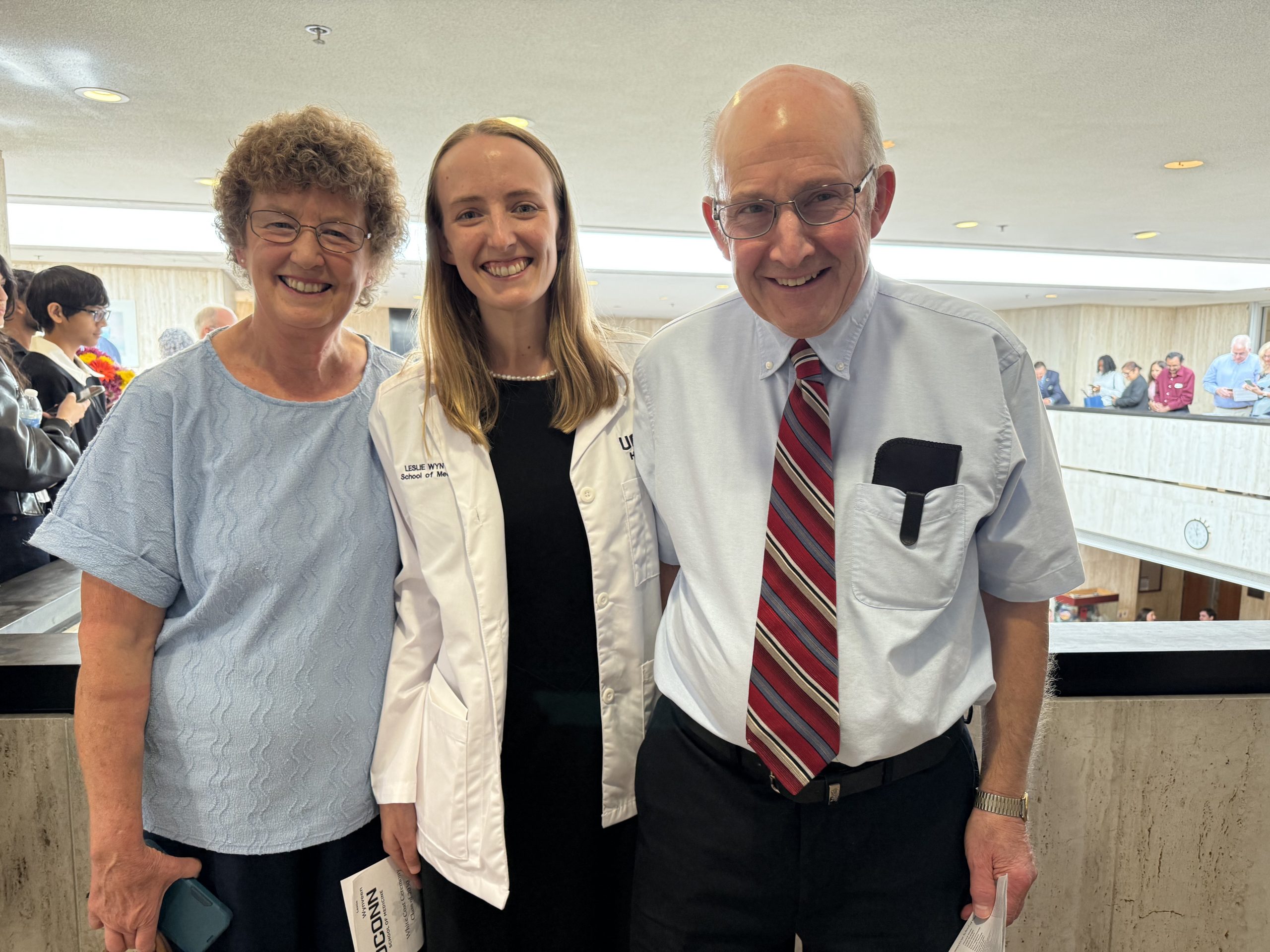 Leslie Wynveen with her parents 2026 UConn School of Medicine White Coat (Photo by Lauren Woods)