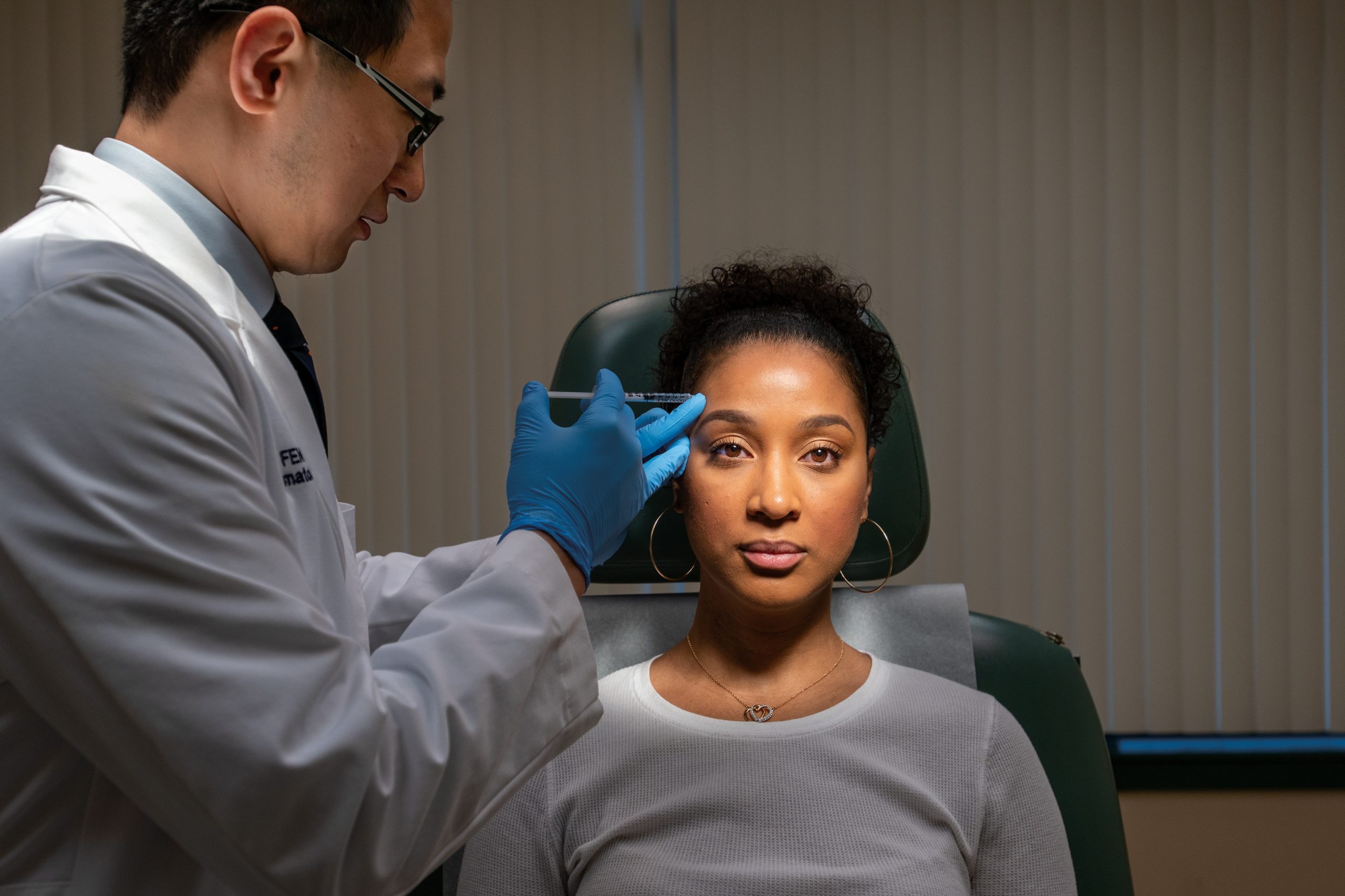 Dr Hao Feng with a patient
