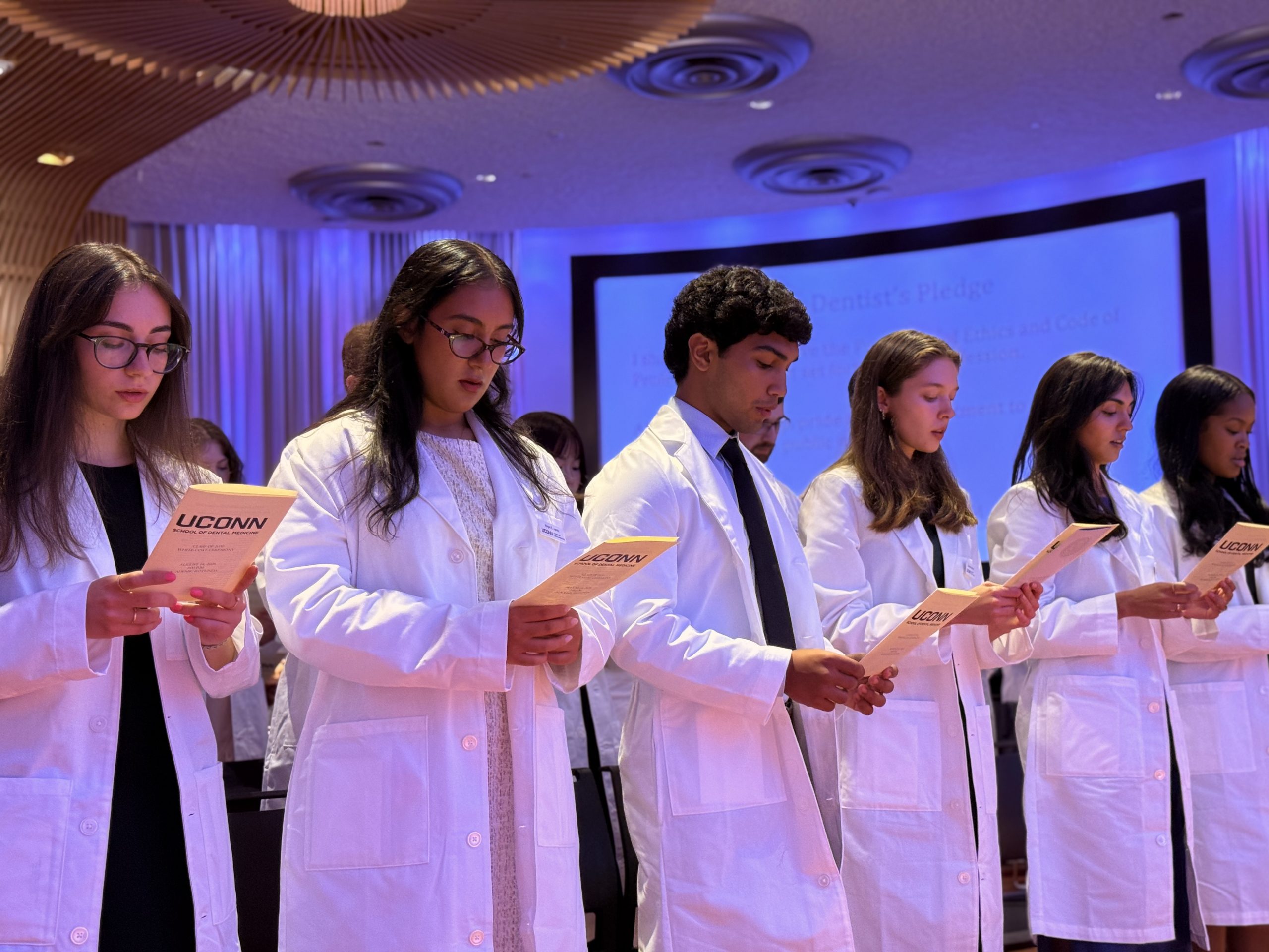 students in white coats