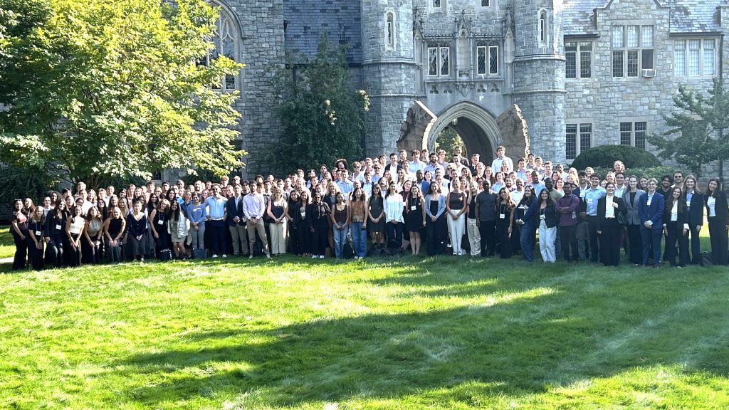 The incoming class of 2026 stands in a large group in front of Starr Hall.