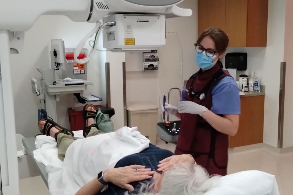 female provider with patient in radiology suite