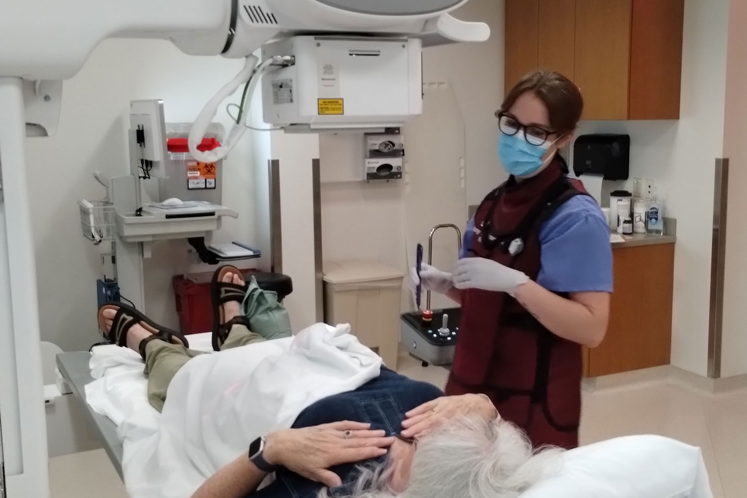 female provider with patient in radiology suite
