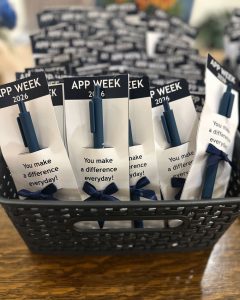 Pens in pouches to commemorate APP Week 2026 with bow and message "You make a difference everyday!"