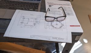 A printed diagram of the pipes and pump experiment.