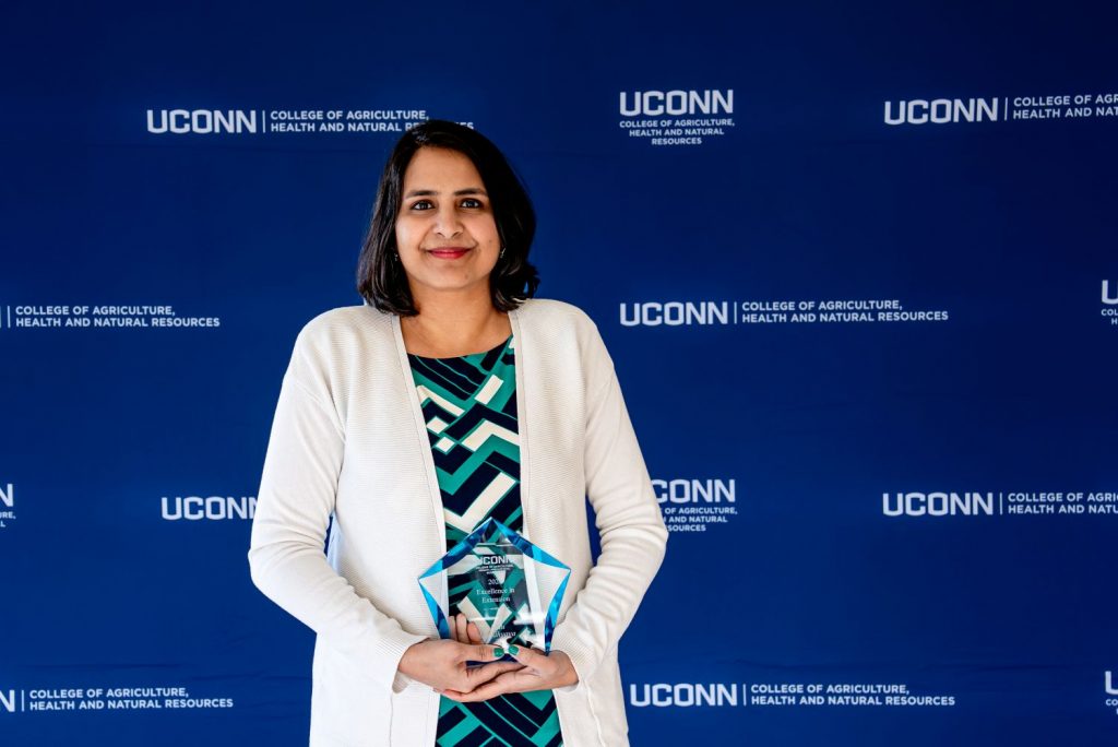 Headshot of Indu Upadhyaya receiving a CAHNR excellence award