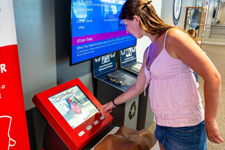 woman at CPR kiosk