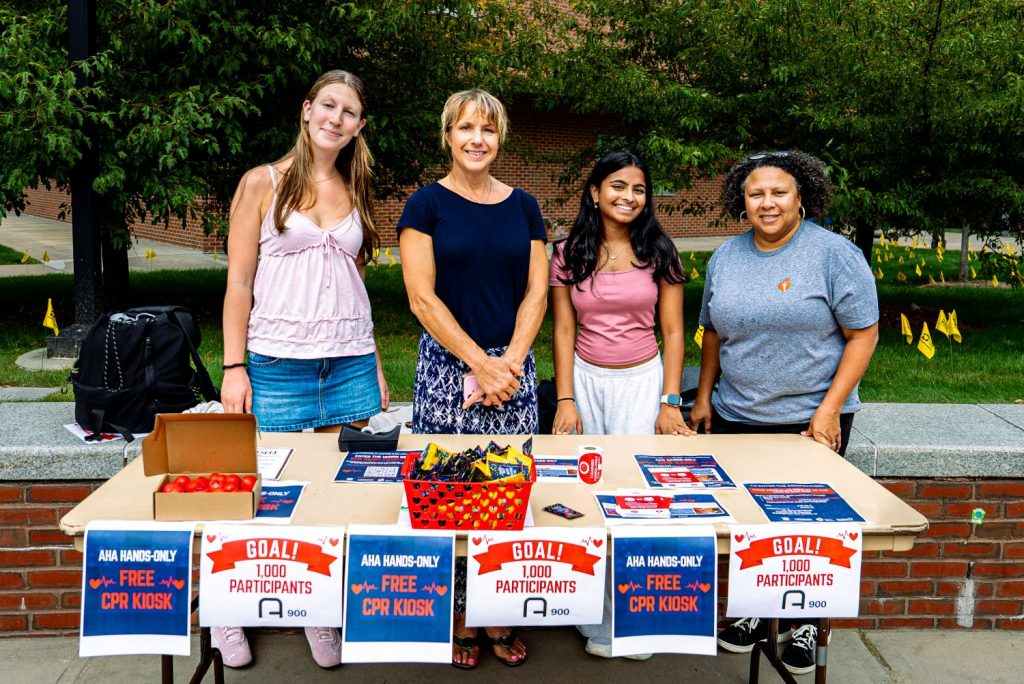 People standing in front of a registration table