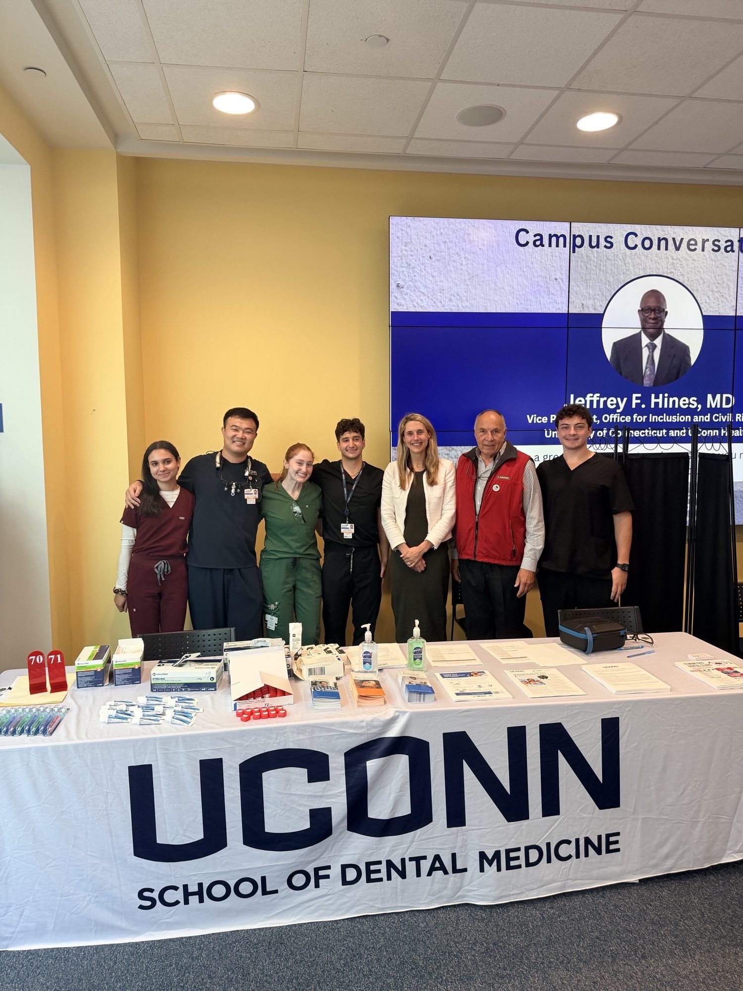 group of students behind booth