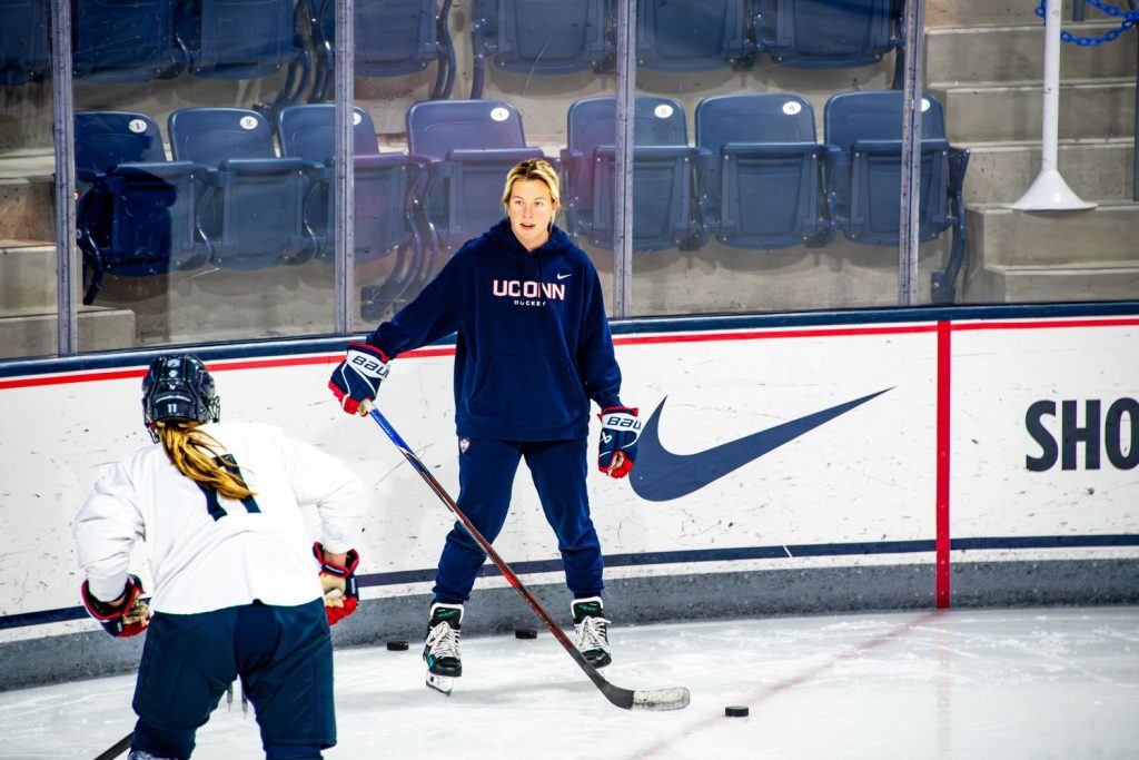 Two women at a hockey practice