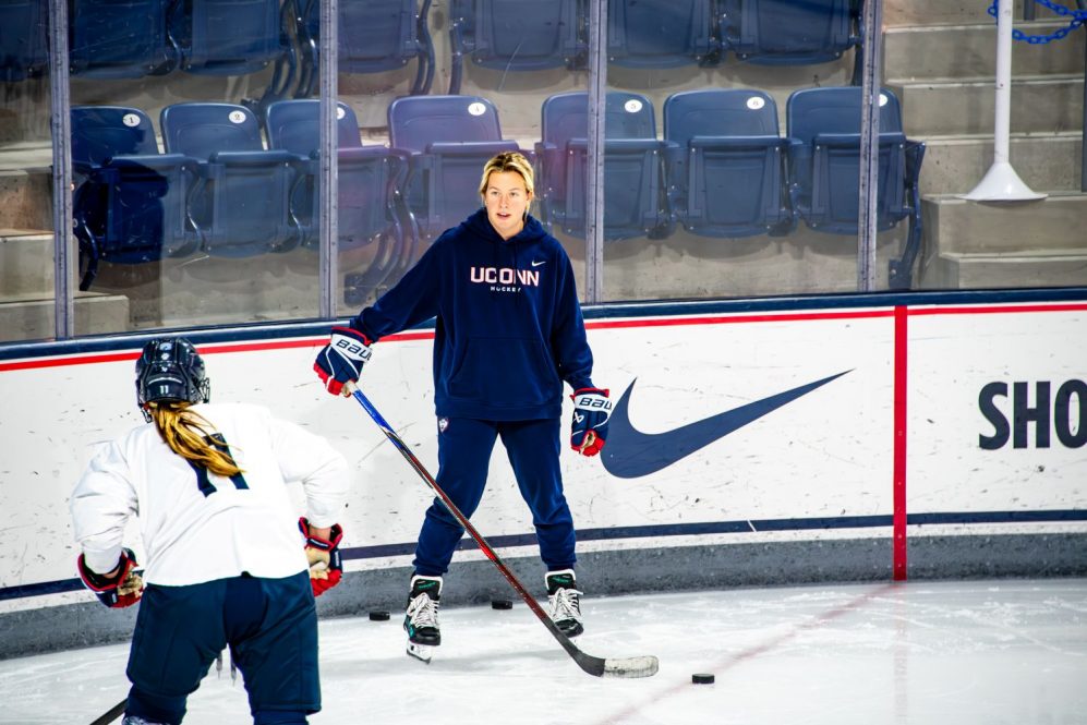 Two women at a hockey practice
