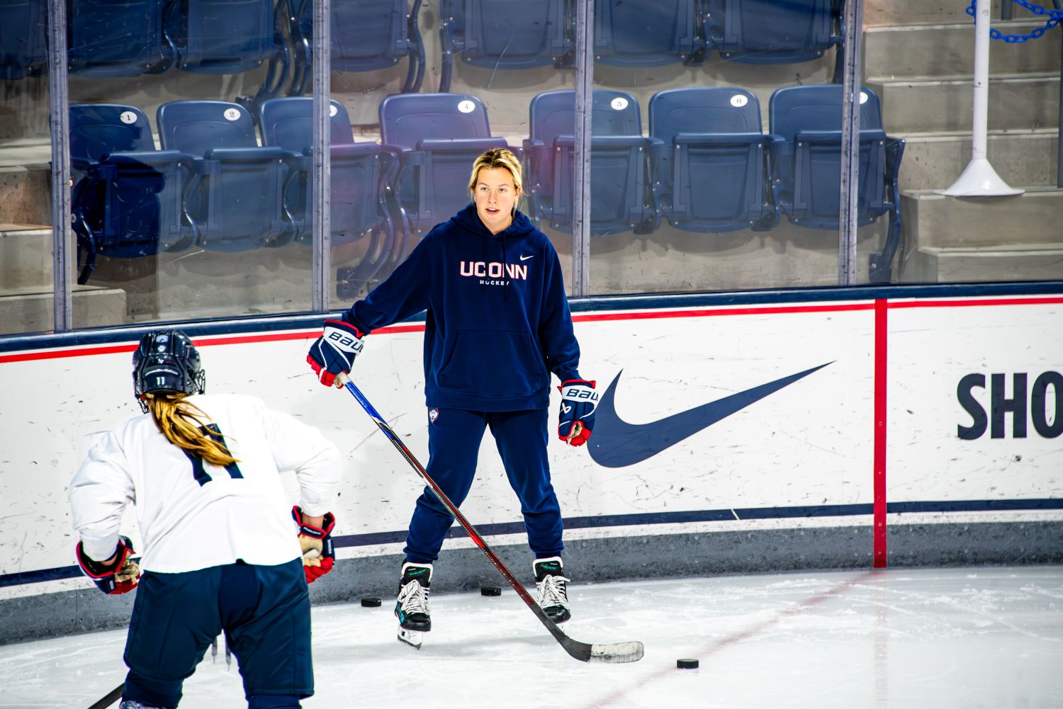 Two women at a hockey practice