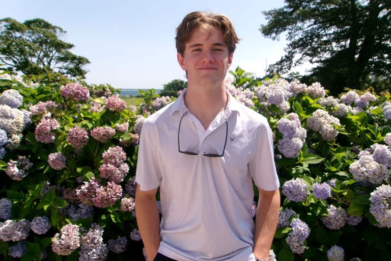 Oliver Gatti outside near flowers