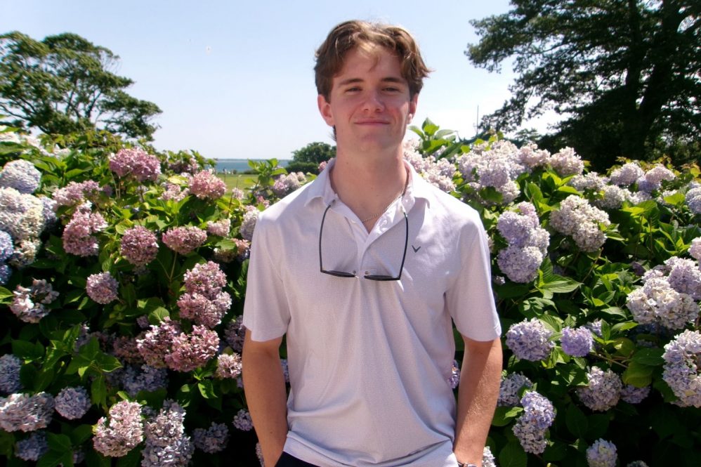 Oliver Gatti outside near flowers