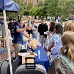 Professor training a group of students on how to administer Narcan