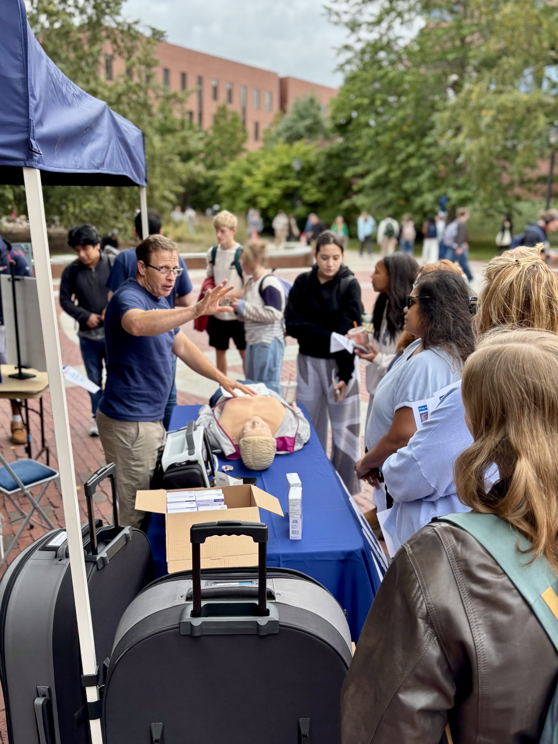 Professor training a group of students on how to administer Narcan