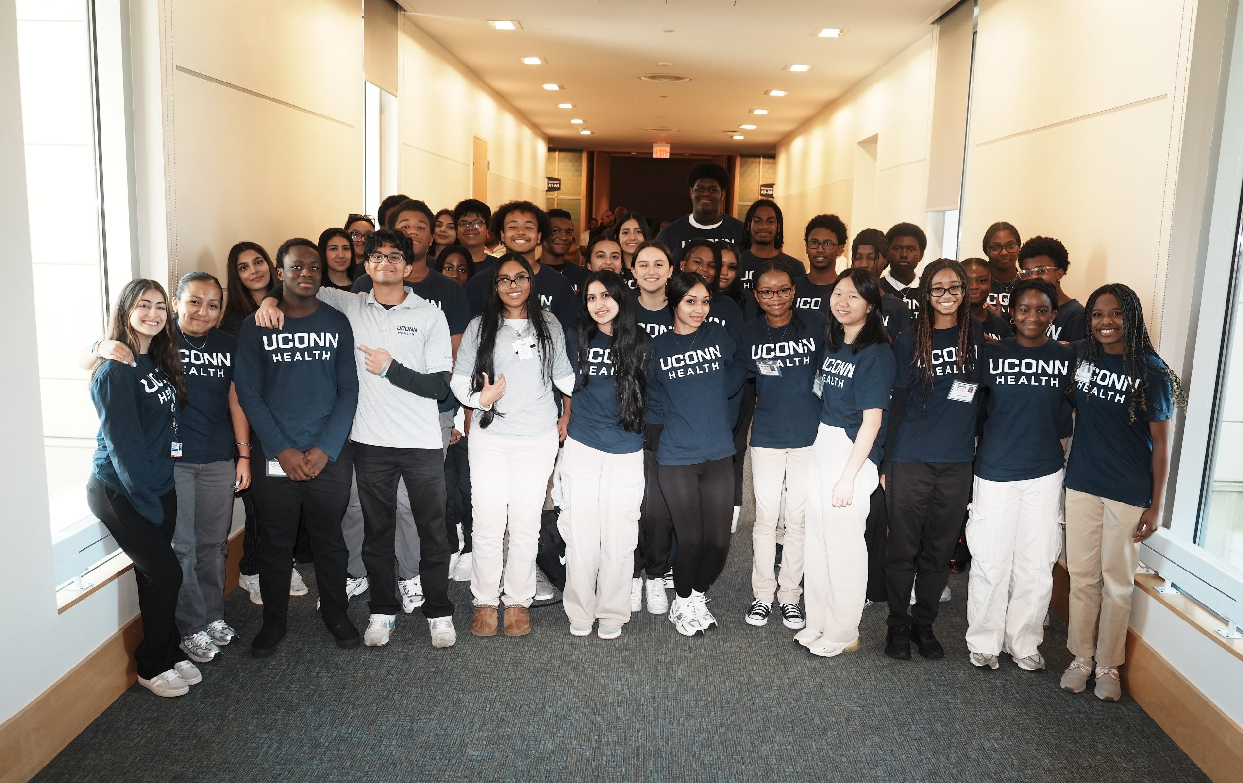 A group of high school students participating in theHCOP Doctors' Academy pose for a group photo.