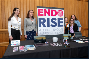 group of women with sign that says Endo Rise