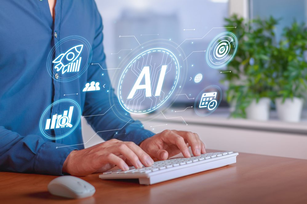 A person typing on a keyboard with hands, while a conceptual AI graphic displays above.