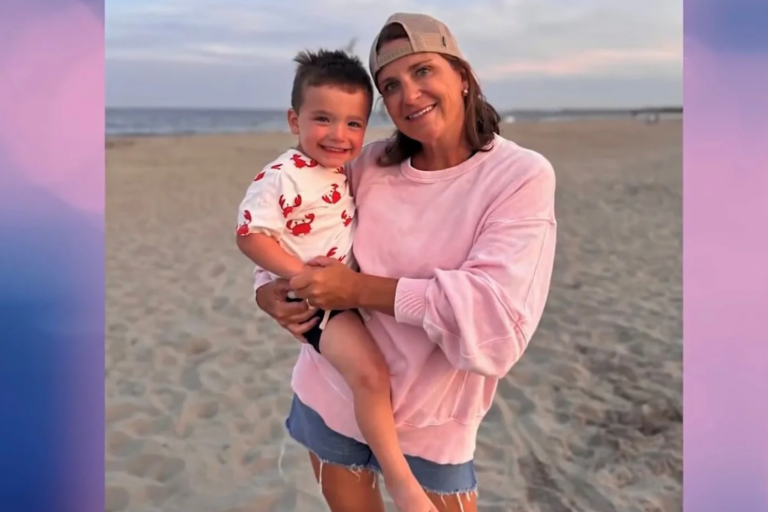 woman holding a little boy at the beach